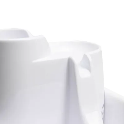 Close-up of a white plastic container with two separate compartments, showing the product’s divided design.