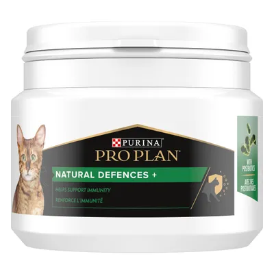 Purina Pro Plan Natural Defences+ cat supplement tub, label shows 'Helps support immunity', 'With postbiotics', image of a cat and green bacteria graphic visible on packaging.