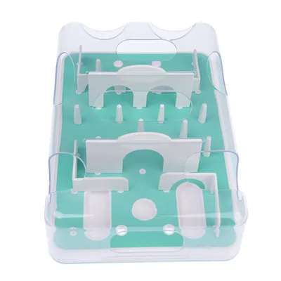 Interactive toy made of plastic with green base and white obstacles, suitable for keeping pets occupied and for training.