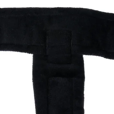 Black padded material with rectangular stitching, close-up of a product.