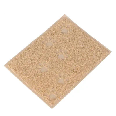 Tapis rectangulaire beige en plastique avec motifs de pattes en relief visibles sur la surface.