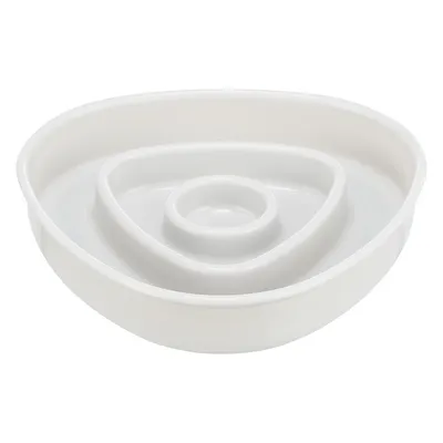 White plastic feeding bowl with raised inner sections designed to slow down eating, shown empty against a plain background.