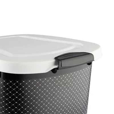 Close-up of a storage container with a white lid and black patterned body, showing the secure handle for easy opening and closing.
