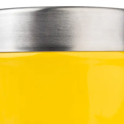 Close-up of a yellow container with stainless steel rim, suitable for storing pet food or accessories.