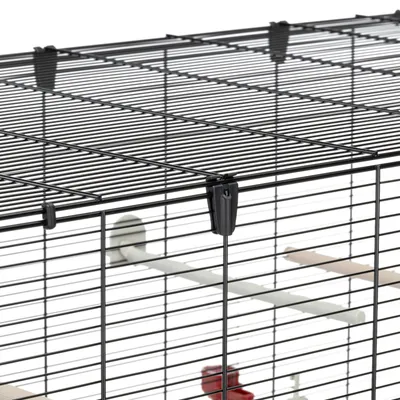 Close-up of a metal wire cage with secure clips, showing interior perches and water bottle attachment.