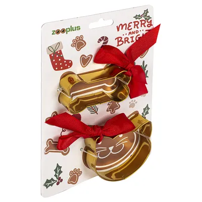 Zooplus cookie cutter set in gold with dog bone and cat head shapes, decorated with red ribbons. Packaging with Christmas design and 'Merry and Bright' lettering.