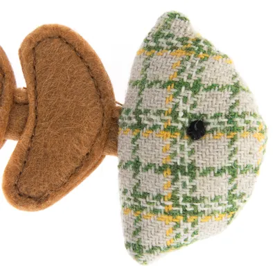 Toy in fish shape made of fabric with green-yellow check pattern and brown felt fins.