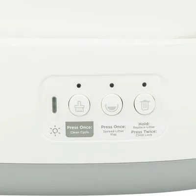 Bedieningspaneel met drie knoppen: schoonmaakcyclus, strooisel verspreiden en verversen. Tekst: Press Once: Clean Cycle, Spread Litter Flat; Hold: Replace Litter; Press Twice: Child Lock.