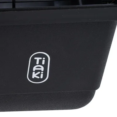Tiaki. Brand for pet products, visible on black plastic.