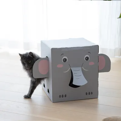 Grey play box in elephant shape with openings, suitable as a hideout or play area for pets. Cat emerging from a side opening.