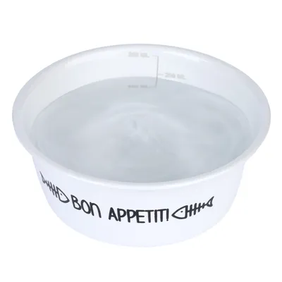 Vit matskål med texten 'Bon Appetit!' och fiskbensmotiv, mätskala upp till 300 ml synlig.