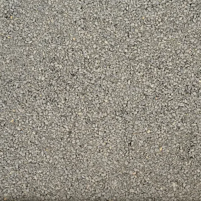 Närbild av grå, finkornig grus eller strömaterial.