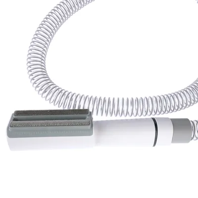 Grey brush with flexible spiral hose, suitable for cleaning or care. No further information visible.