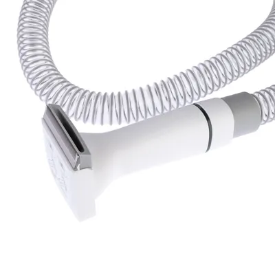 White shaving head with metal blade and flexible spiral cable, suitable for precise cutting or trimming.