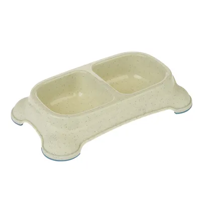Dublu bol din plastic crem cu două compartimente pentru hrană și apă, antiderapant datorită picioarelor din cauciuc albastru.
