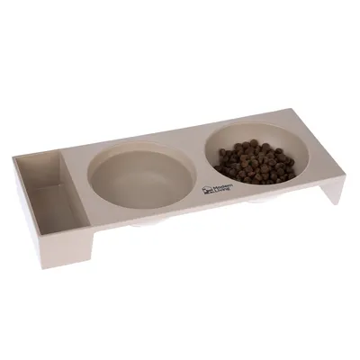Modern Living estación de alimentación con dos cuencos, uno lleno de pienso seco y otro vacío, color beige.