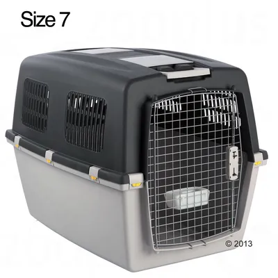 Plastic pet carrier with metal wire door, side ventilation panels, and water bowl inside. Visible text: Size 7.