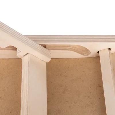 Close-up view of a wooden structure made of light wood with precise cut-outs and stable joints.