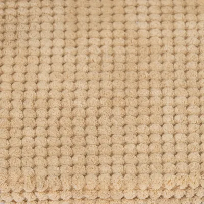 Detailný záber na béžový štruktúrovaný povrch s tkaným vzorom, pravdepodobne materiál na produkty pre domáce zvieratá.