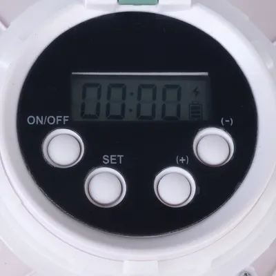 Digital display with buttons: ON/OFF, SET, (+), (-) and symbols for battery and charging status.