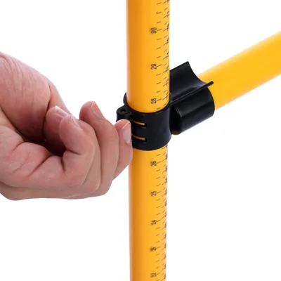 Yellow rod with centimetre scale and black clamp being adjusted by a hand.