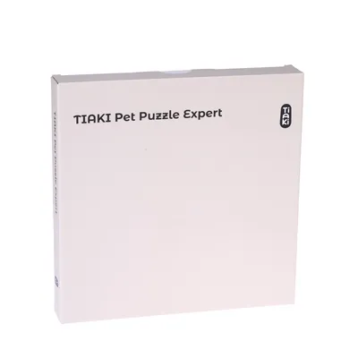 Emballage avec texte : TIAKI Pet Puzzle Expert et logo Tiaki visibles sur la boîte.