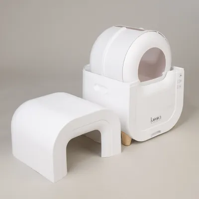 Kooa automatic cat toilet in white with removable protective roof and control panel. Modern design for easy cleaning.