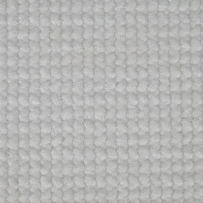 Prim-plan al unei suprafețe de material textil alb, texturat, cu model țesut.