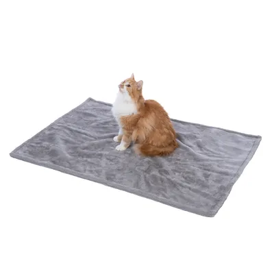 Grey blanket made of soft material with a red and white cat sitting on it. Product for pets.