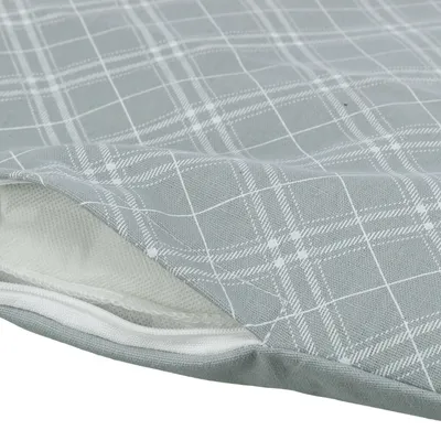 Housse en tissu gris à motif quadrillé blanc avec fermeture éclair visible, ouverture partielle montrant la doublure intérieure blanche.