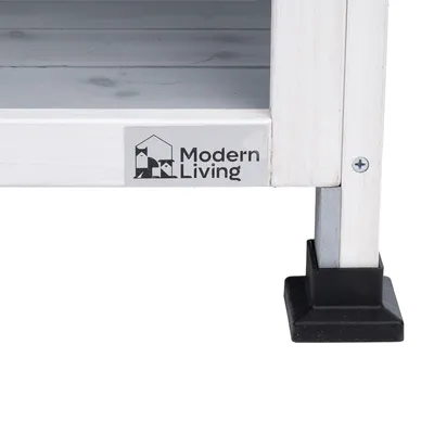Modern Living logo på en hvid træramme med metalben og sorte plastfødder.