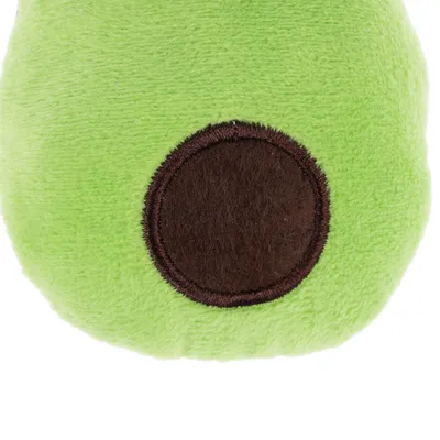 Green plush toy with brown circle in the centre, close-up view.