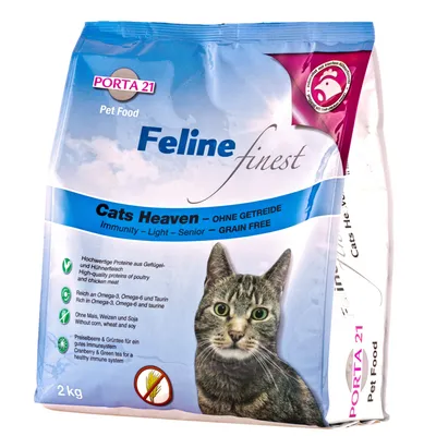 Balení Porta 21 Feline finest Cats Heaven, 2 kg, bez obilovin, Immunity – Light – Senior – Grain Free, obrázek kočky, viditelný text v angličtině a němčině o složení a benefitech.