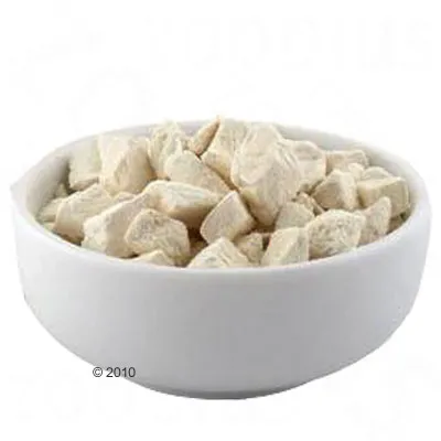 White bowl with small, light dry food pieces. Product image shows the consistency and shape of the food pieces.
