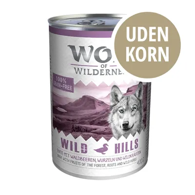 Wolf of Wilderness Wild Hills dåse, 100 % grain-free, uden korn, and med skovbær, rødder og vilde urter, 400 g. Tekst på engelsk og tysk synlig.