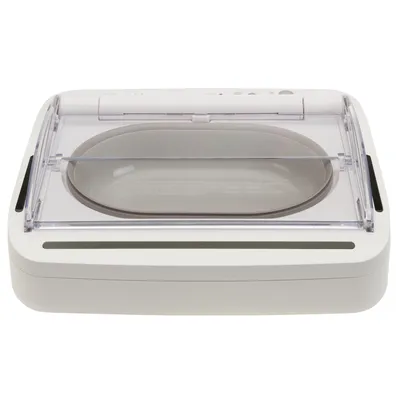 Automatic pet feeder with transparent lid and oval food bowl, shown closed. Designed to keep food fresh until opened.
