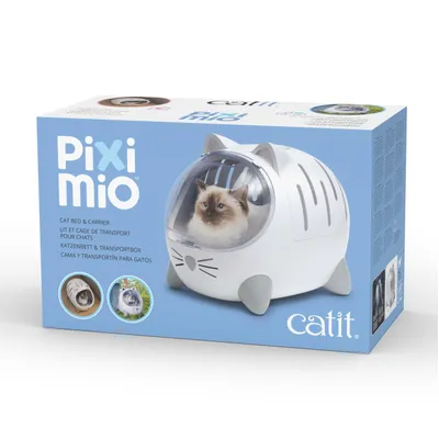 Pixi mio kattekurv & transportboks fra catit, billede af en hvid boks med vindue og kat indeni. Tekst på flere sprog på emballagen.
