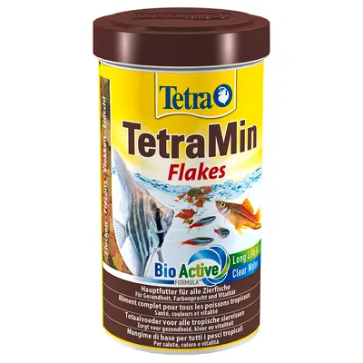 Boîte TetraMin Flakes, aliment complet pour poissons tropicaux, texte visible : BioActive Formula, Long Life & Clear Water, santé, couleurs et vitalité.