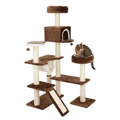 Brown cat tree with multiple levels, cave, hammock and sisal scratching surfaces. Cat sitting on a platform.