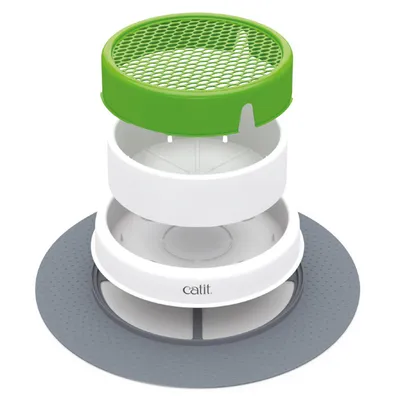 Exploded view of Catit drinking fountain with green filter, white water container and grey base. Shows the individual components of the product.