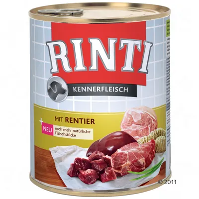 Lata de comida para perros Rinti Kennerfleisch, texto visible: Mit Rentier, noch mehr natürliche Fleischstücke. Imagen de trozos de carne en la etiqueta.