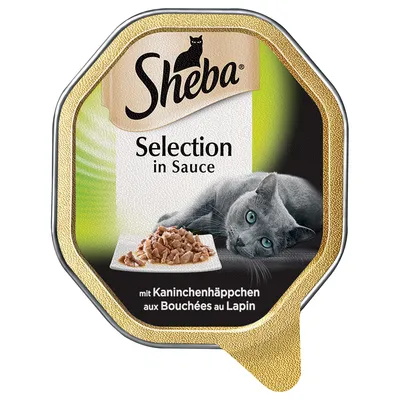Sheba Selection in Sauce, mit Kaninchenhäppchen, emballage med billede af grå kat og tallerken med kødstykker i sauce. Tekst også på fransk: aux Bouchées au Lapin.