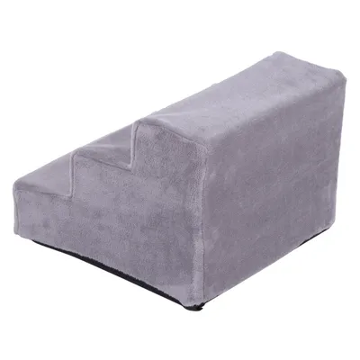 Trapje met drie treden, bekleed met grijze stof. Geschikt voor huisdieren om hoogteverschillen te overbruggen. Materiaal: stof en kunststof zichtbaar.