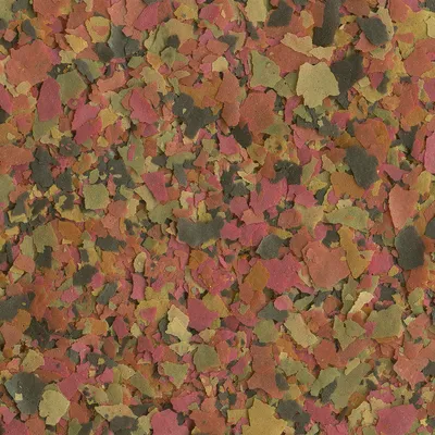 Bunte Flockenfischfutter-Mischung in verschiedenen Farben: Rot, Grün, Gelb und Braun. Bunte Flockenfischfutter-Mischung in verschiedenen Farben: Rot, Grün, Gelb und Braun.
