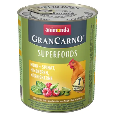 Conservă Animonda GranCarno Superfoods, text vizibil: Huhn + Spinat, Himbeeren, Kürbiskerne. Imagine cu pui, spanac, zmeură, semințe de dovleac. 1 tierisches protein. 100% frisches Huhn.