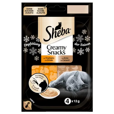 Sheba Creamy Snacks con tacchino e anatra, senza zuccheri aggiunti, confezione da 4 x 12 g, raccomandazione stagionale, alimentazione per mano, immagine di un gatto.