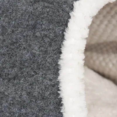 Close-up of grey felt material with white plush edge, suitable for pet products such as beds or caves.