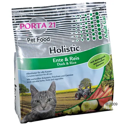 Porta 21 Holistic kissanruoka, ankka & riisi. Täysravinto kaikille kissoille, sisältää ravinteikkaita ainesosia, yrttejä, hedelmiä ja vihanneksia. Pakkauksessa kissa ja maatalousmaisema.