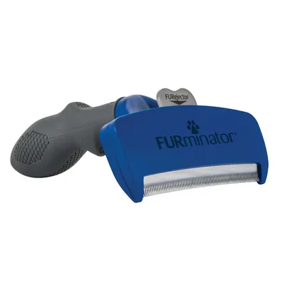 Cepillo azul con mango negro y púas metálicas, marca FURminator, texto visible 'FURminator' y 'FURejector' en la parte superior.