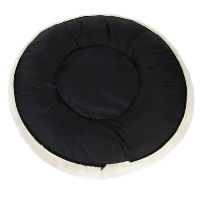 Round black padded mat with a light-coloured edge, shown from above to display its shape and surface texture.